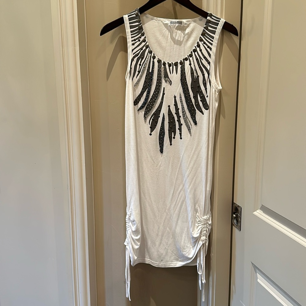 Beautifully detailed tunic that can be worn as a dress or with leggings.